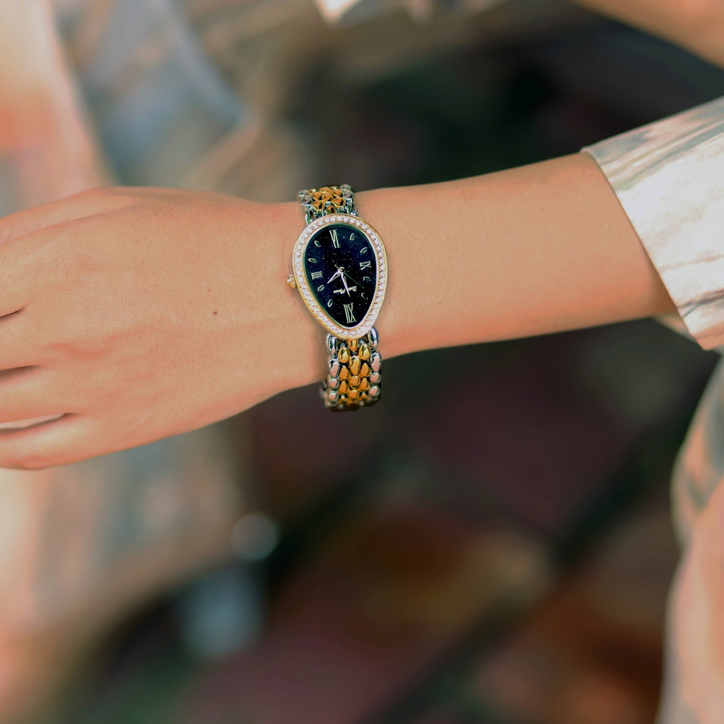 Girl Wearing Silver Gold Watch With Black Dial