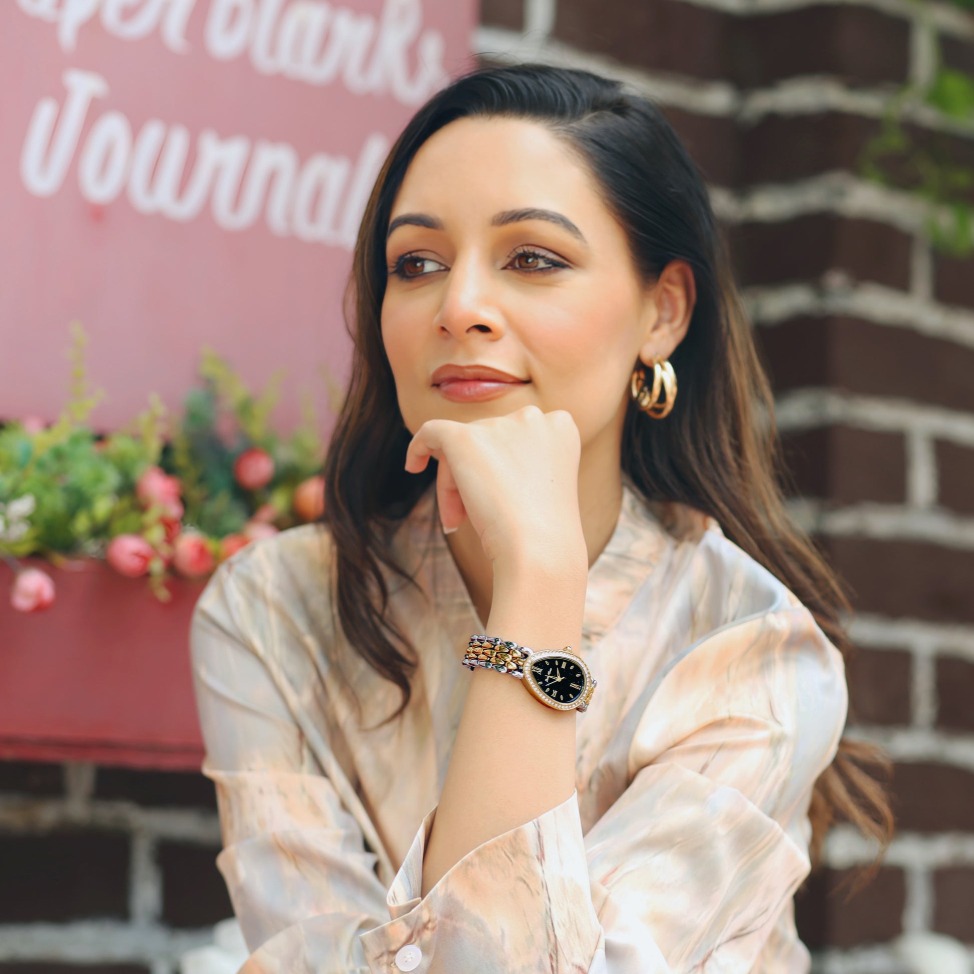Girl Wearing Silver Gold Watch With Black Dial